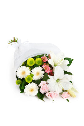 White lilies and white gerberas arranged for delivery in Italy.