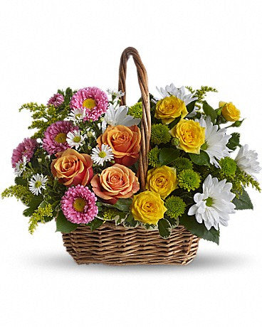 Mixed spring flower basket for delivery in Italy.